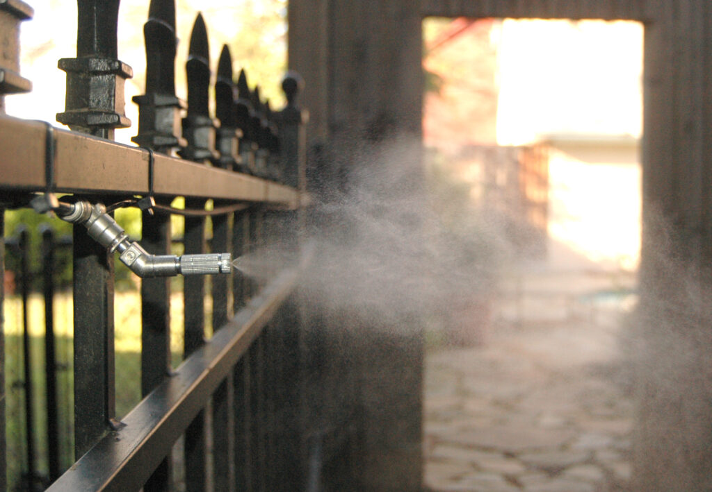 Mosquito misting system protecting a backyard
